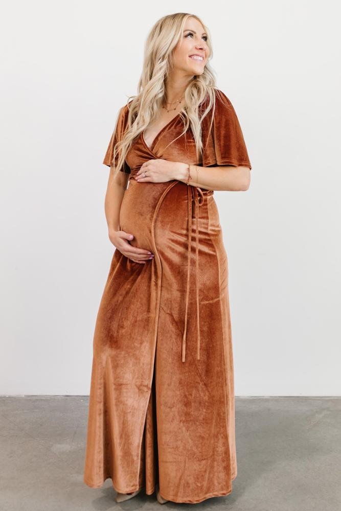 Detail view of the waist tie and V-neck wrap construction on the spice velvet maxi, highlighting the adjustable fit and closure.