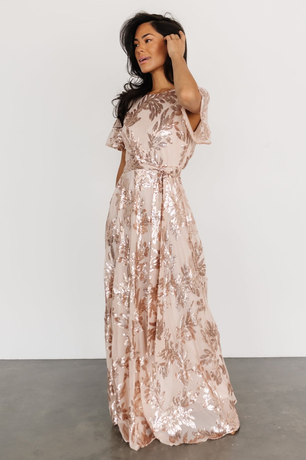 Close-up of the short sheer sleeve and shoulder showing delicate transparency contrasted with the fully sequined bodice.