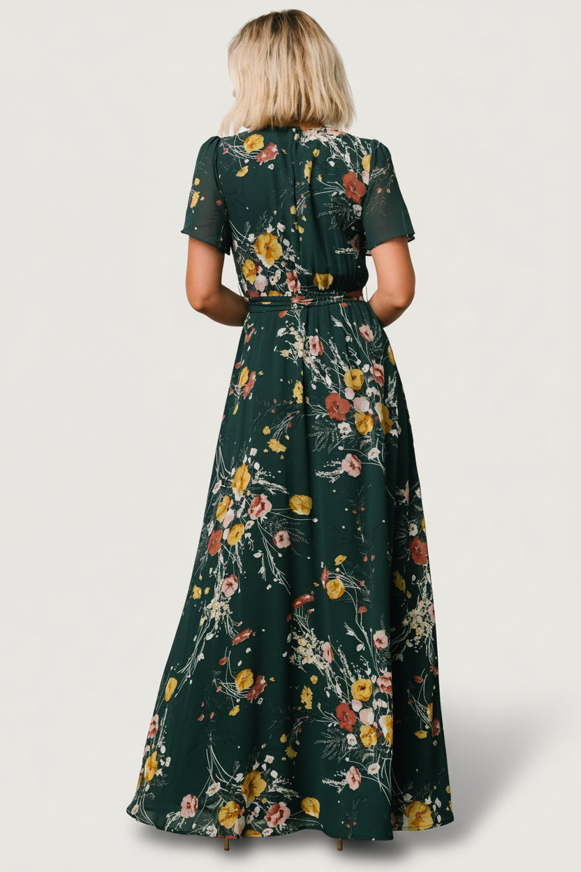 Back view of dress showing keyhole and single-button closure at the nape plus elastic back waist for a flexible fit.