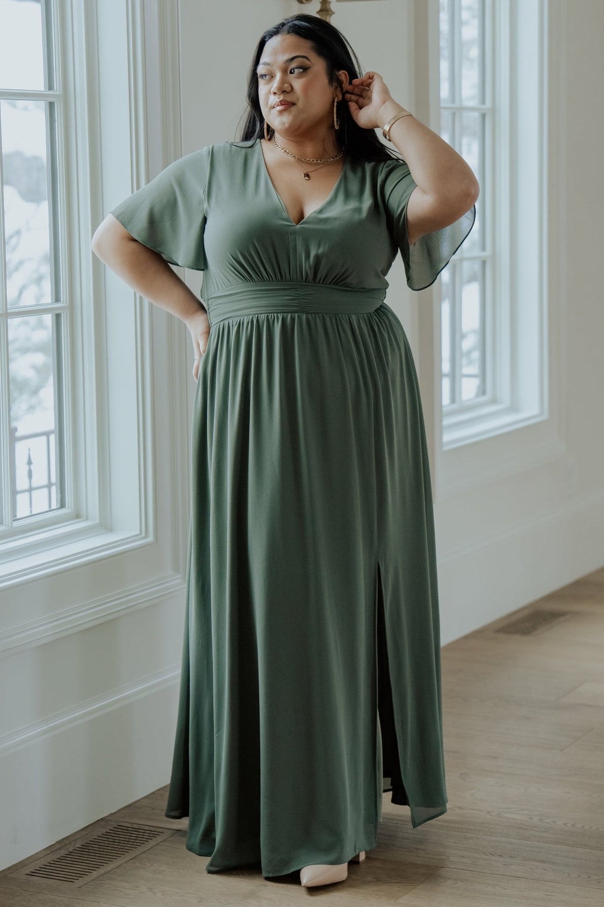 Side view of Ramona Maxi Dress in dark sage displaying the left leg slit, flowing skirt, and flattering silhouette.