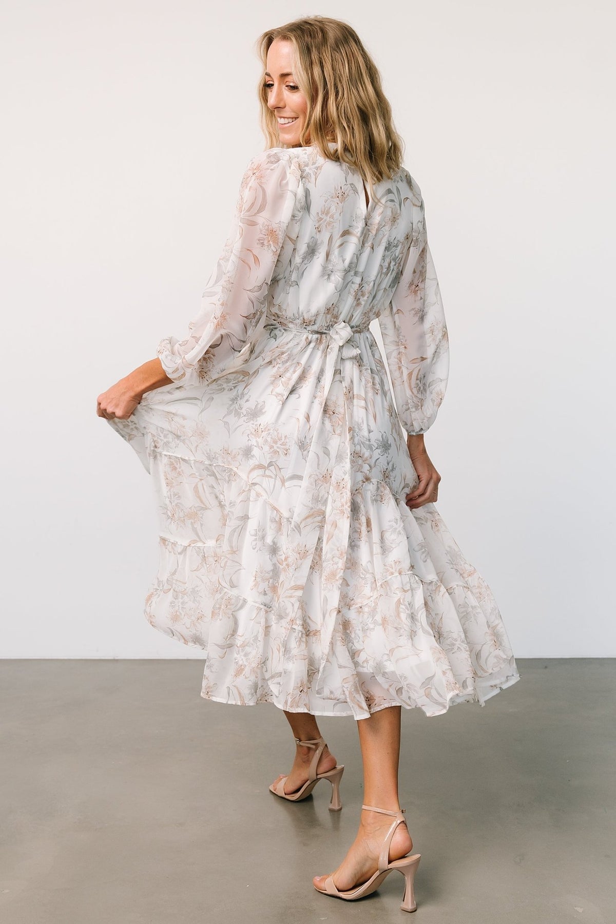 Back view of the Raven chiffon midi dress on model, featuring the keyhole at back neck and attached side ties at the waist.