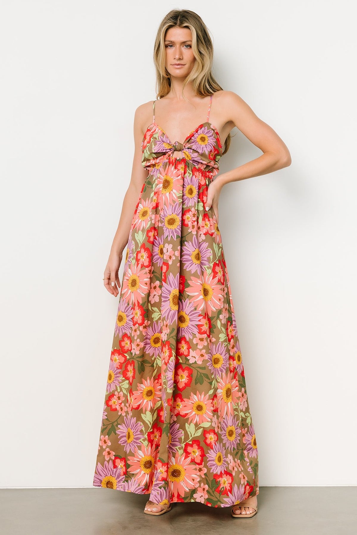 Rosalee maxi dress laid flat showing full floral pattern in olive, pink, yellow and purple and unlined skirt length.