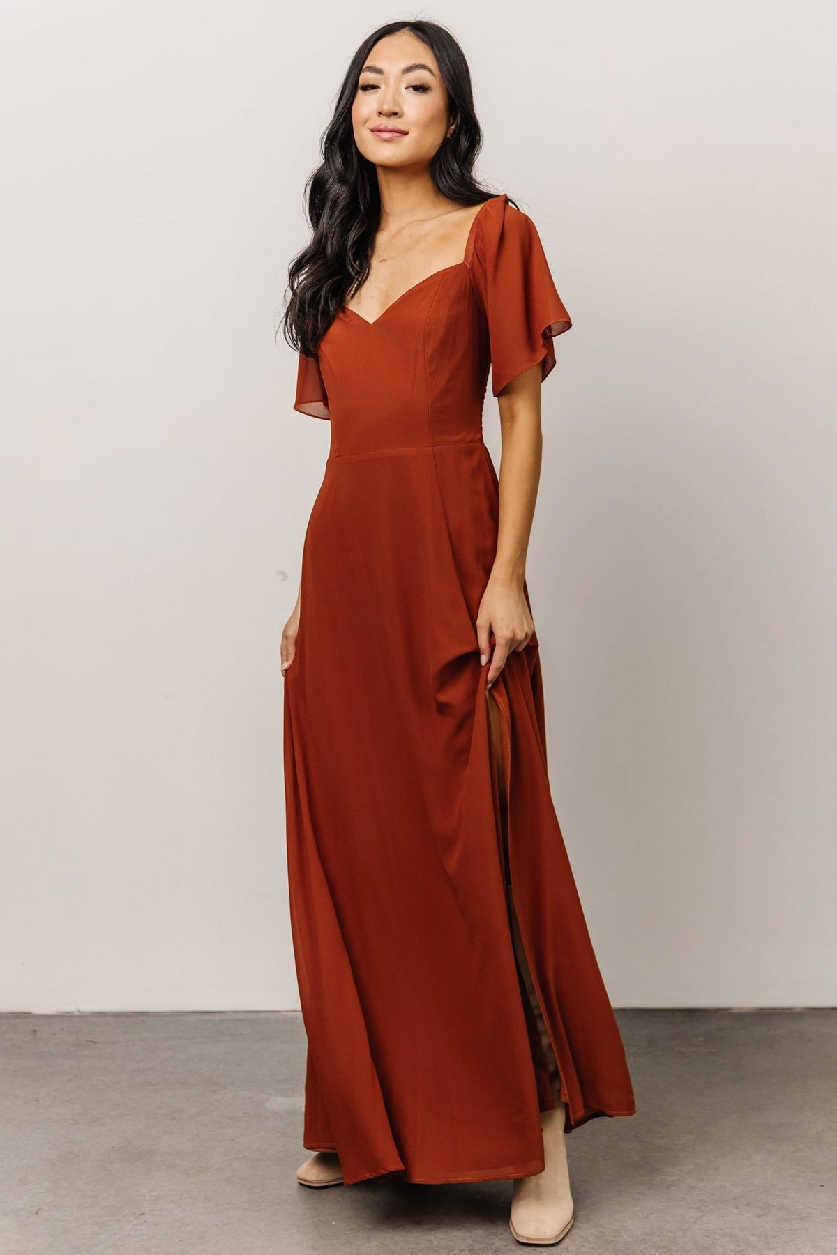 Front view of Spice chiffon maxi dress with sweetheart neckline, smocked back detail visible, short sleeves and flowing hemline